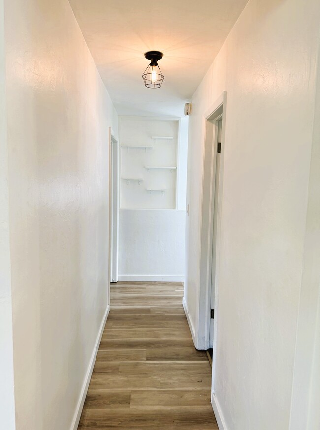 Hallway to Bedroom and Office with privacy - 3670 NE 6th Ave