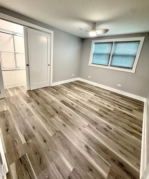 Second bedroom or Office with solid plank flooring, new closet organizer, fan & blinds. - 16W671 56th St