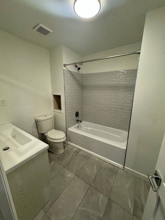 Building Photo - Stylish & Modern Living in the Heart of Tr...