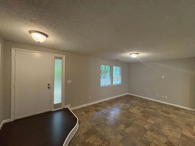Building Photo - Four Bedroom Townhome Available Now
