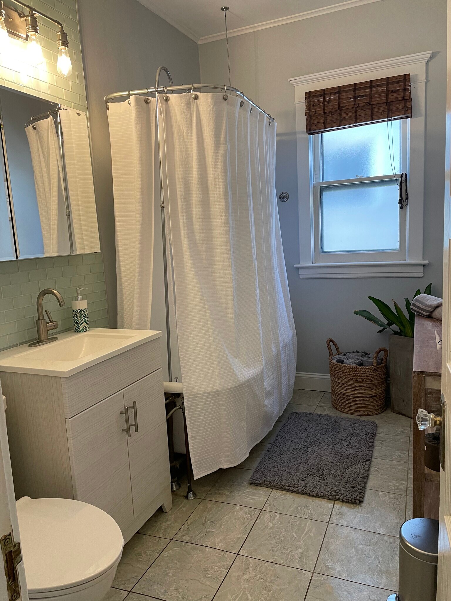 Bathroom with ample storage and claw foot soaking tub. - 28 Saint James Pl