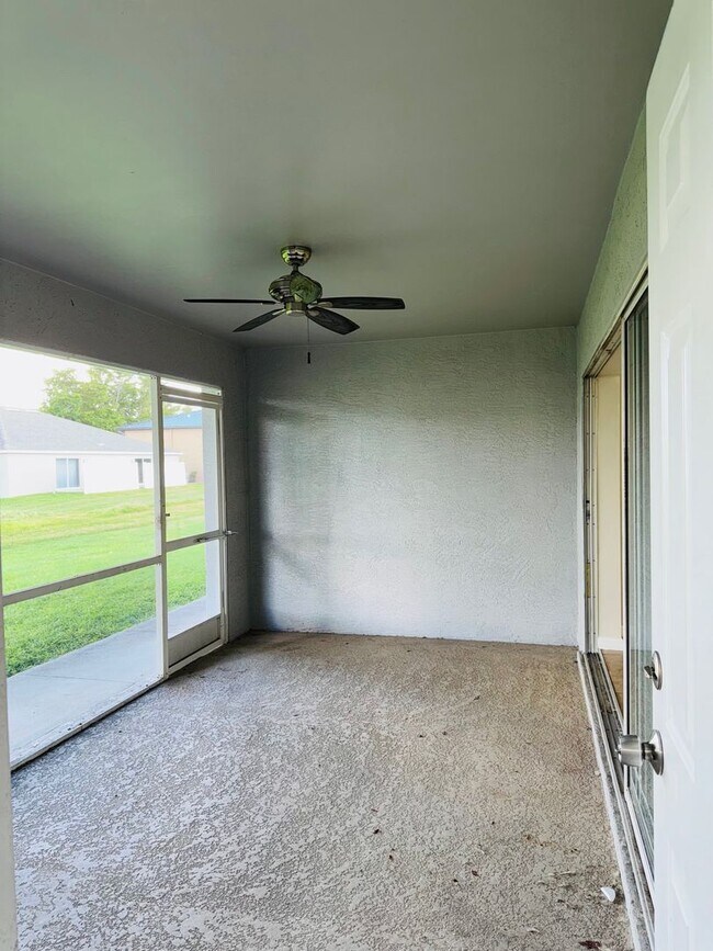 Building Photo - Experience this Cape Coral 3 bedroom 2 bath corner duplex with 1 car garage and screened in lanai.