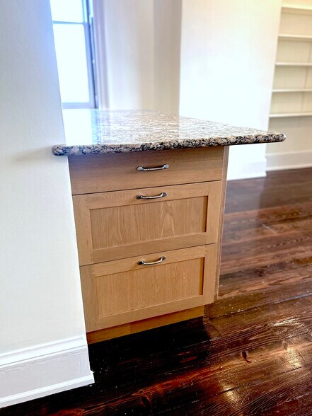 Kitchen counter with 30" wide granite counter and storage - 301 M St NW