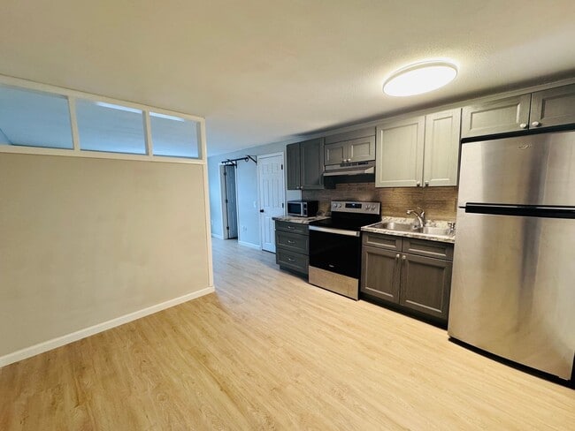 Building Photo - Price Improvement! $1500 Hot Water Included | Looking for the perfect studio in Dover with a pool...