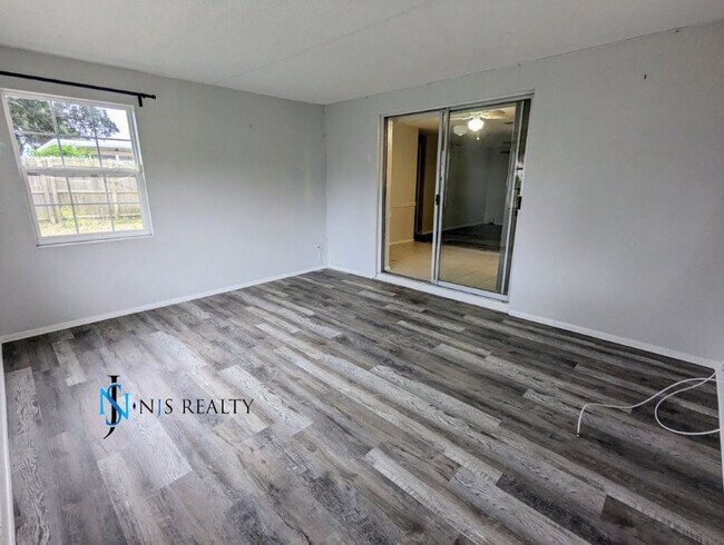 Building Photo - NEW FLOORS, NEW PAINT INSIDE & OUT.. 2/1/1...