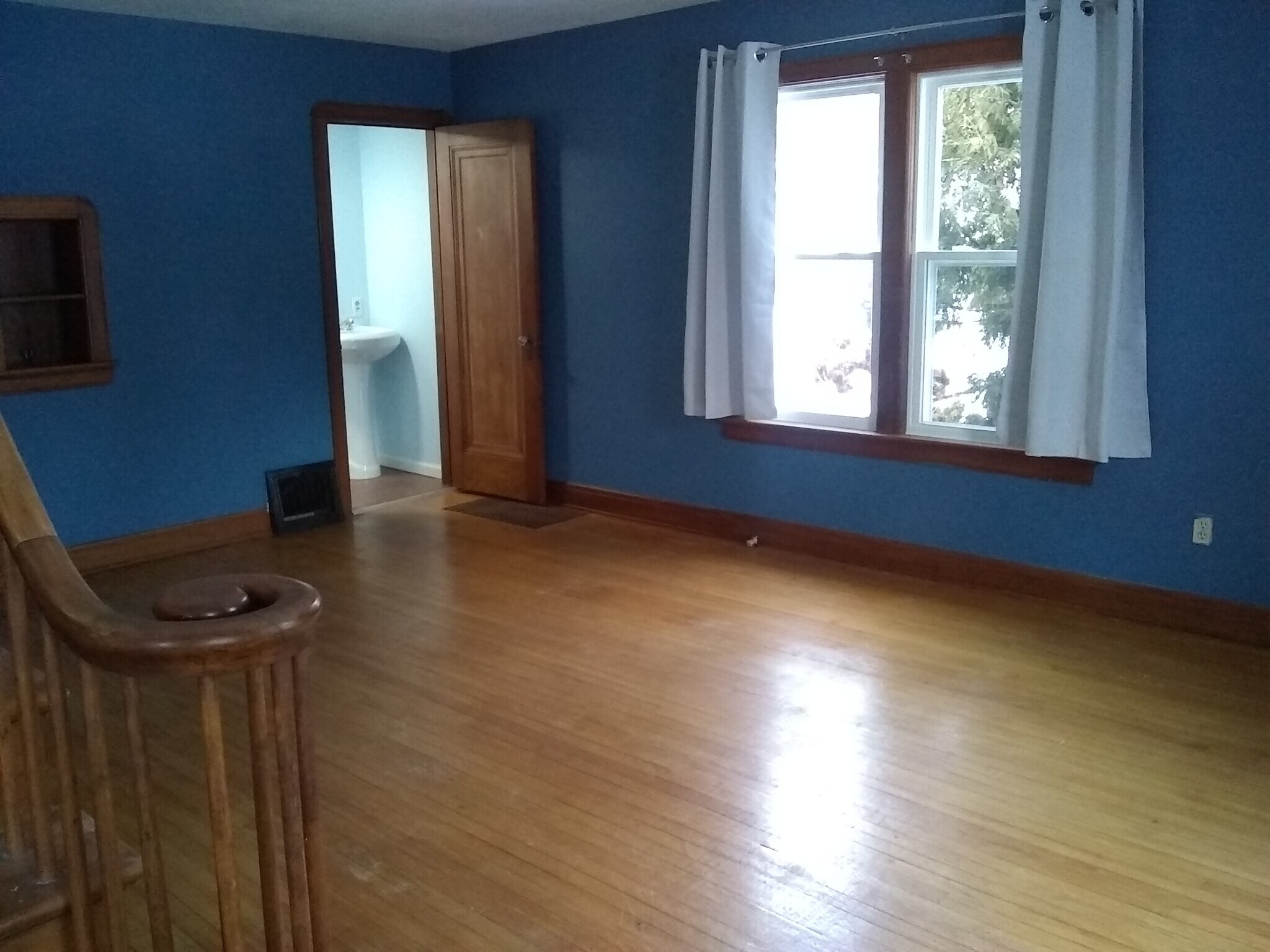 Living Room (view from bottom of stairs, front door) - 2105 Eastlawn Pkwy