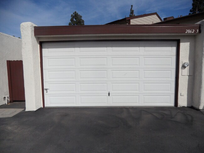 Building Photo - Two Story 4 BR 2.5 BA Condo With 2 Car Garage