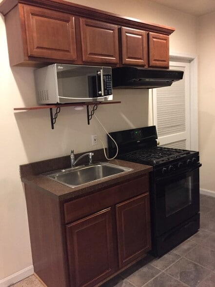 Kitchen sink, microwave, and range / oven - 1606 Rising Ridge Rd