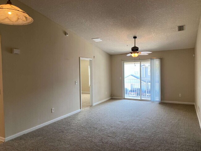 Building Photo - Beautifully Updated & Spacious 3BR/2BA Condo in a Secure Gated Community — Includes Cable, Intern...