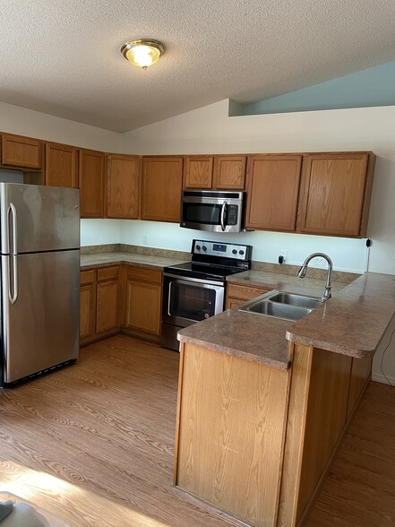 Open Kitchen, Stainless appliances and under cabinet lighting - 424 N Savary Ave