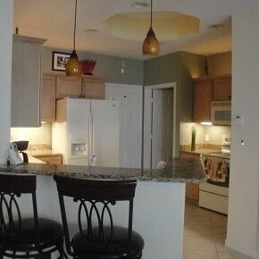 kitchen view refg. microwave, range under counter lights and abov cabinetse - 9800 Quinta Artesa Way