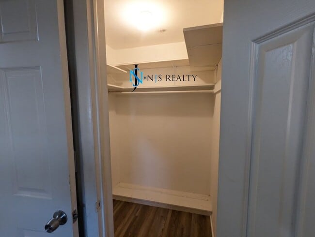 Building Photo - 2/2/1 with  RENOVATED baths & kitchen, fenced yard, NEW lvp flooring and a OVERSIZED lanai!