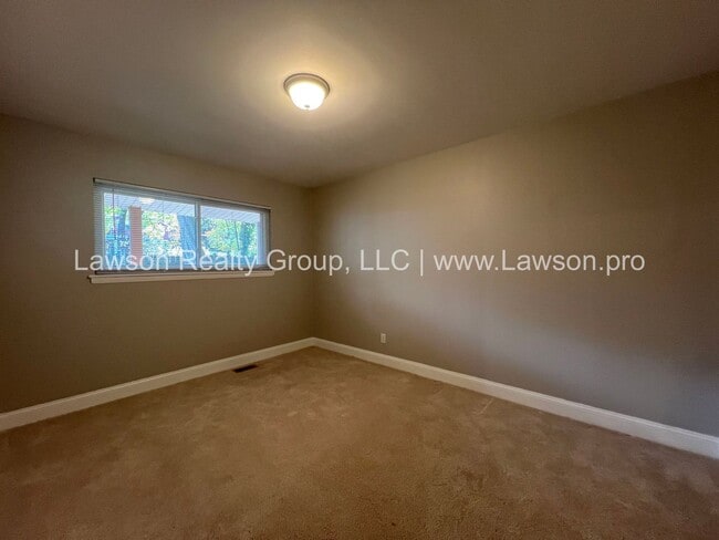 Building Photo - Charming Brick Ranch with Beautifully Landscaped Yard and Attached Carport