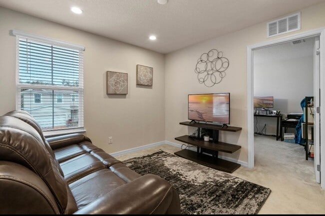 Building Photo - Water Front Home- 4 Large Bedrooms-3 baths Gated Community Call Sheila Campbell 407-687-7900