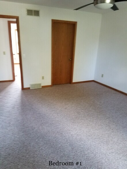 Main bedroom w view to hallway and walk-in closet #2 - 1010 N Gammon Rd