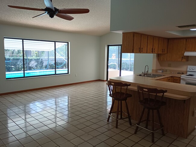 Building Photo - 3 bedroom 2 bathroom 1948 Sq ft Pool Home ...