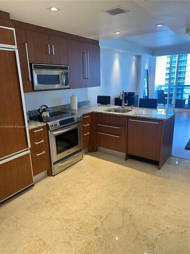 Building Photo - 10275 Collins Ave