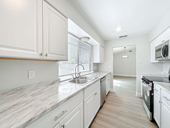 Building Photo - Stunning Waterfront Home located in the de...