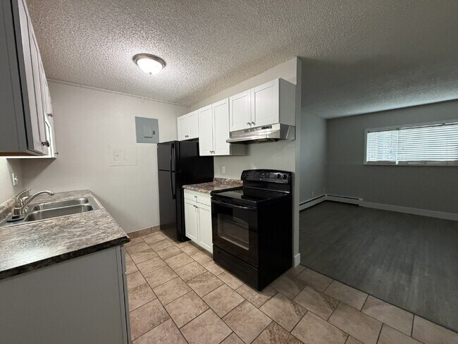 Building Photo - Updated & Clean 2BR Condo - Utilities Included - Laundry, Parking & Pool