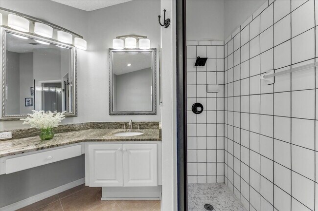 Building Photo - A vibrant 2-bedroom, 2-bathroom tropical retreat designed for both high-energy entertaining and l...