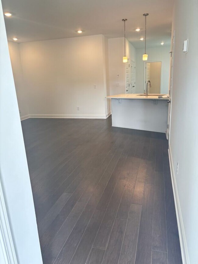 Building Photo - **BE THE LUCKY ONE TO LIVE IN THIS 2024-BUILT END-UNIT TOWNHOME IN A RESORT-STYLE COMMUNITY**