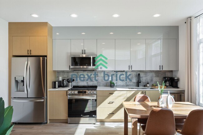 Building Photo - Offer: Unfurnished option available at $3,250, with an optional furnished package for an addition...