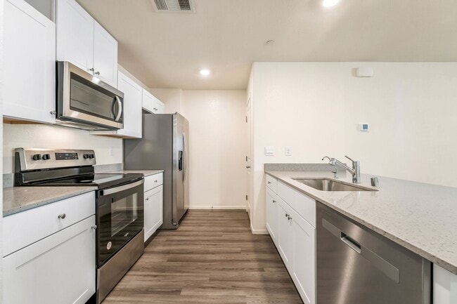 Building Photo - Modern West Henderson Townhome with Sleek Upgrades & Smart Home Features!