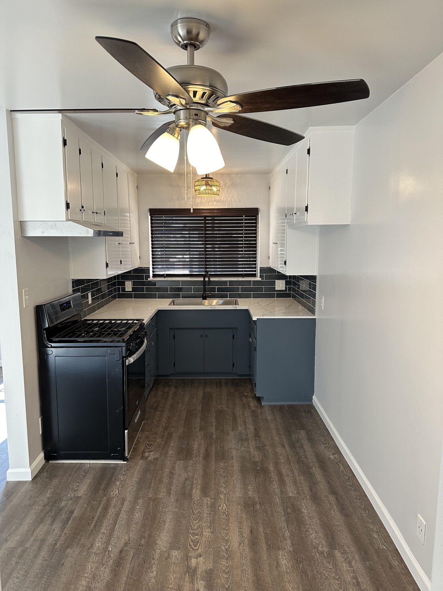 Updated kitchen with quartz countertops and stainless steel appliances - 1016 Western Ave