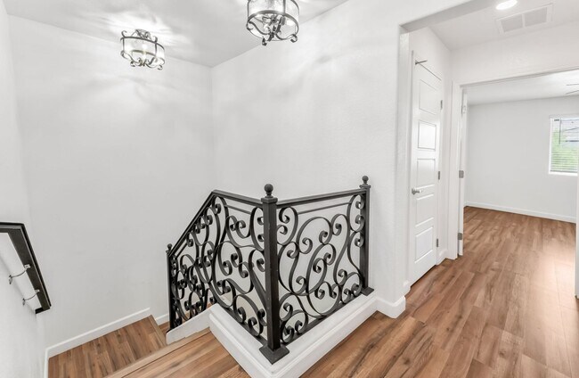 Building Photo - Modern Gated Townhome with Flexible Living Spaces & Stylish Finishes!