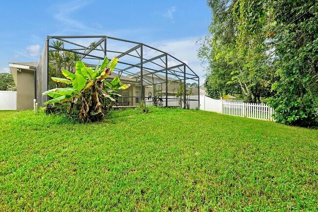 Building Photo - "Stunning 3BR Orlando Home with Private Screened Pool, Spa & Spacious Living Areas"