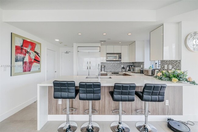 Building Photo - 10275 Collins Ave