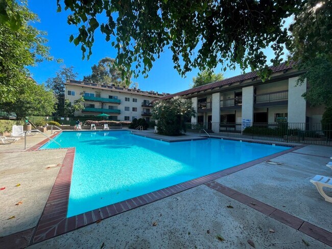 Building Photo - AVAILABLE NOW! 1BR w/patio, pool + spa, gym, parking + MORE!