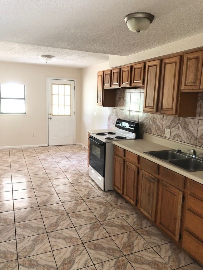 Building Photo - Spacious 3BR/1BA with Huge Yard & Charming...