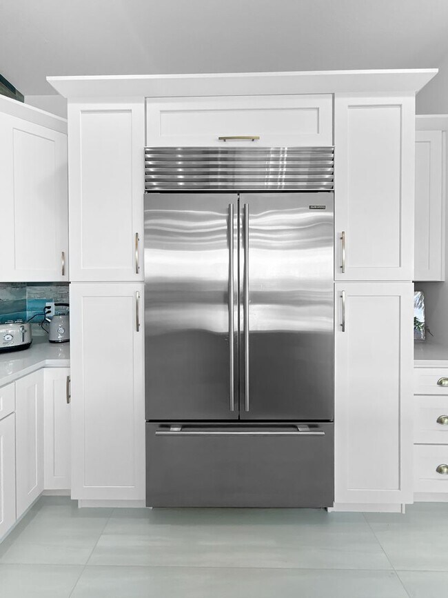 Building Photo - Waterfront Johns Pass Luxury | Steps to Beach + Pool, Hot Tub & Dock