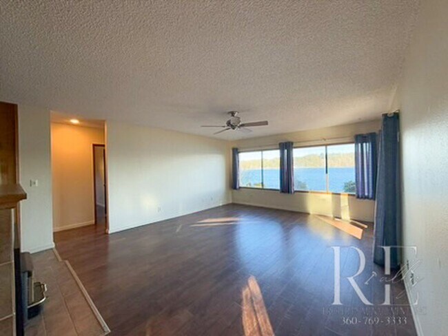 Building Photo - Waterfront Bliss: Stunning Puget Sound Views & Your Own Private Beach!