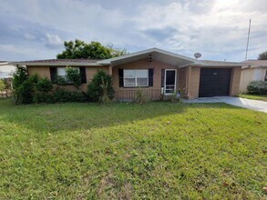 Building Photo - BEAUTIFUL 2/1/1 864Sq. Ft. with tile/wood ...