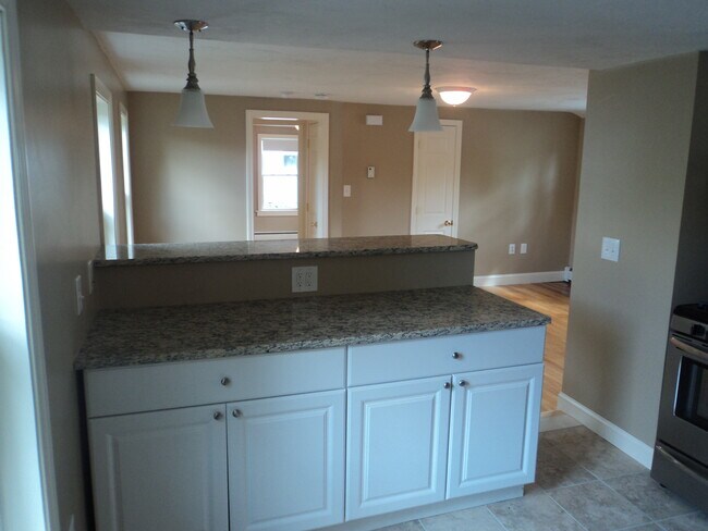 Kitchen looking into living room - 25 Common St