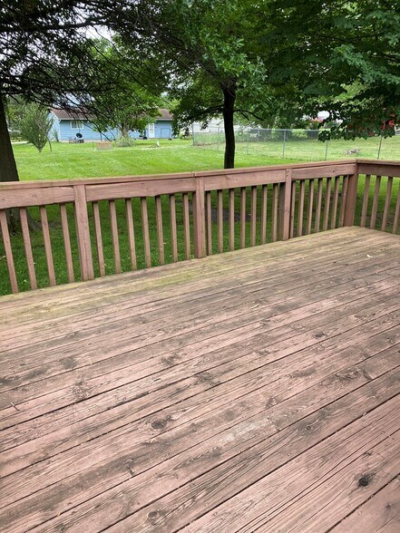 Huge deck looking out to a flat lawn - 609 W Hildreth St