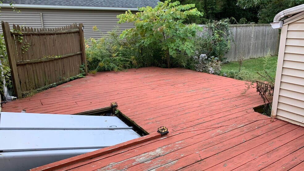 Deck leading from sun room, bulkhead shown - 58 Oakwood Dr