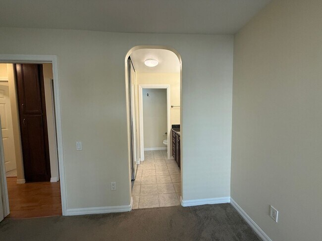 Building Photo - Upgraded Condo with Private Patio, AC, Pool, Gym, and Covered Parking in Gated Community