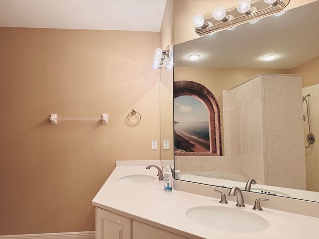 Building Photo - Experience Bell Tower Park. GATED ground floor 2 Bed 2 Bath Den 1 Car Garage Condo.