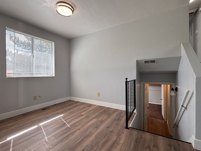 Building Photo - Cozy Home with New Paint & Flooring!