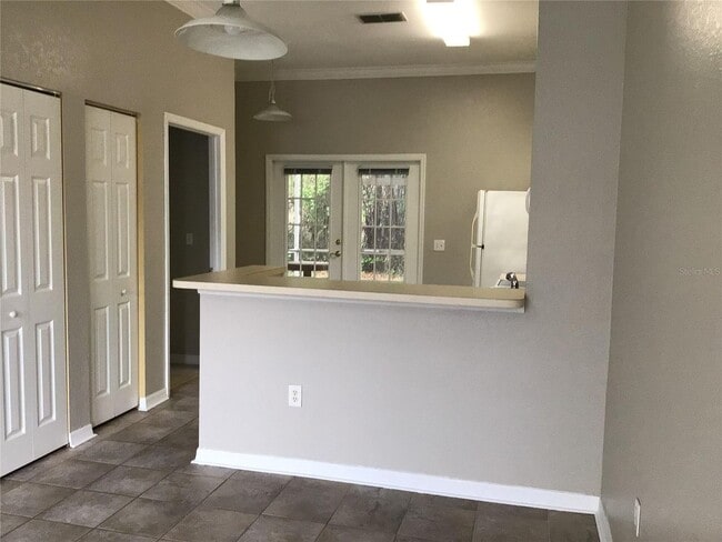 Building Photo - 2 Bedroom 2 Bath Corner Unit Ground Floor Condo Near UCF with Tile Flooring and Scenic View!
