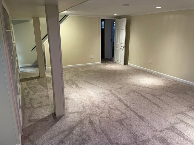 Basement, door leads to stairs to porch and another bedroom - 48 Hope Rd