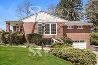 Building Photo - Welcome to this charming abode.