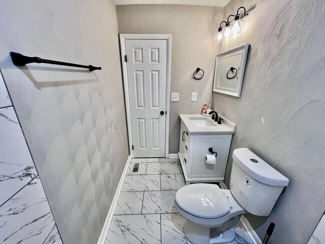 Building Photo - Come see this FULLY renovated two-story tr...