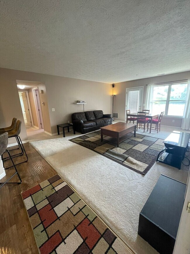Building Photo - 2 Bed + Office Condo | Pool, Garage & Flexible Move-In