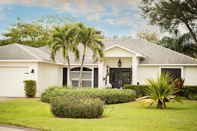 Building Photo - ANNUAL RENTAL - Beach Cottage with 2 Car Garage 'The Lakehouse' in tropical garden