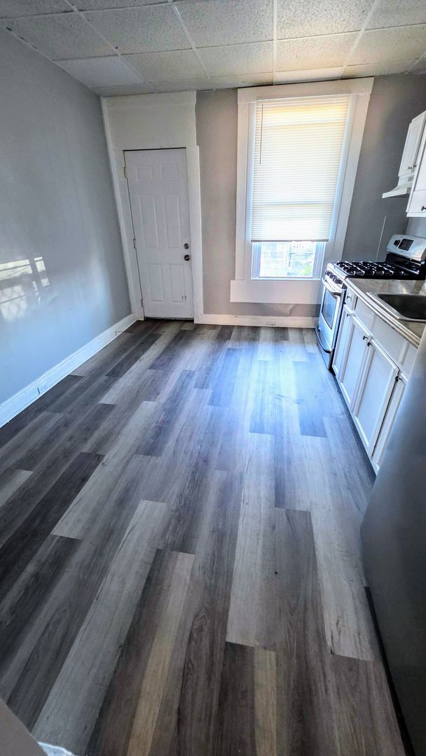 Building Photo - Beautiful Two Bedroom, Plus a Pass Through Room with a Fenced in Rear Patio