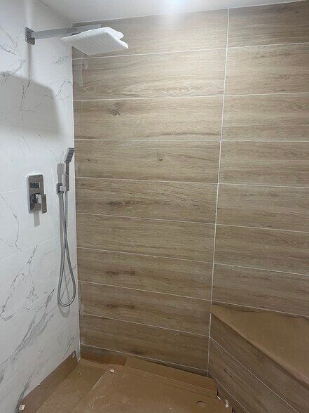 Tile and marble shower - 10275 Collins Ave